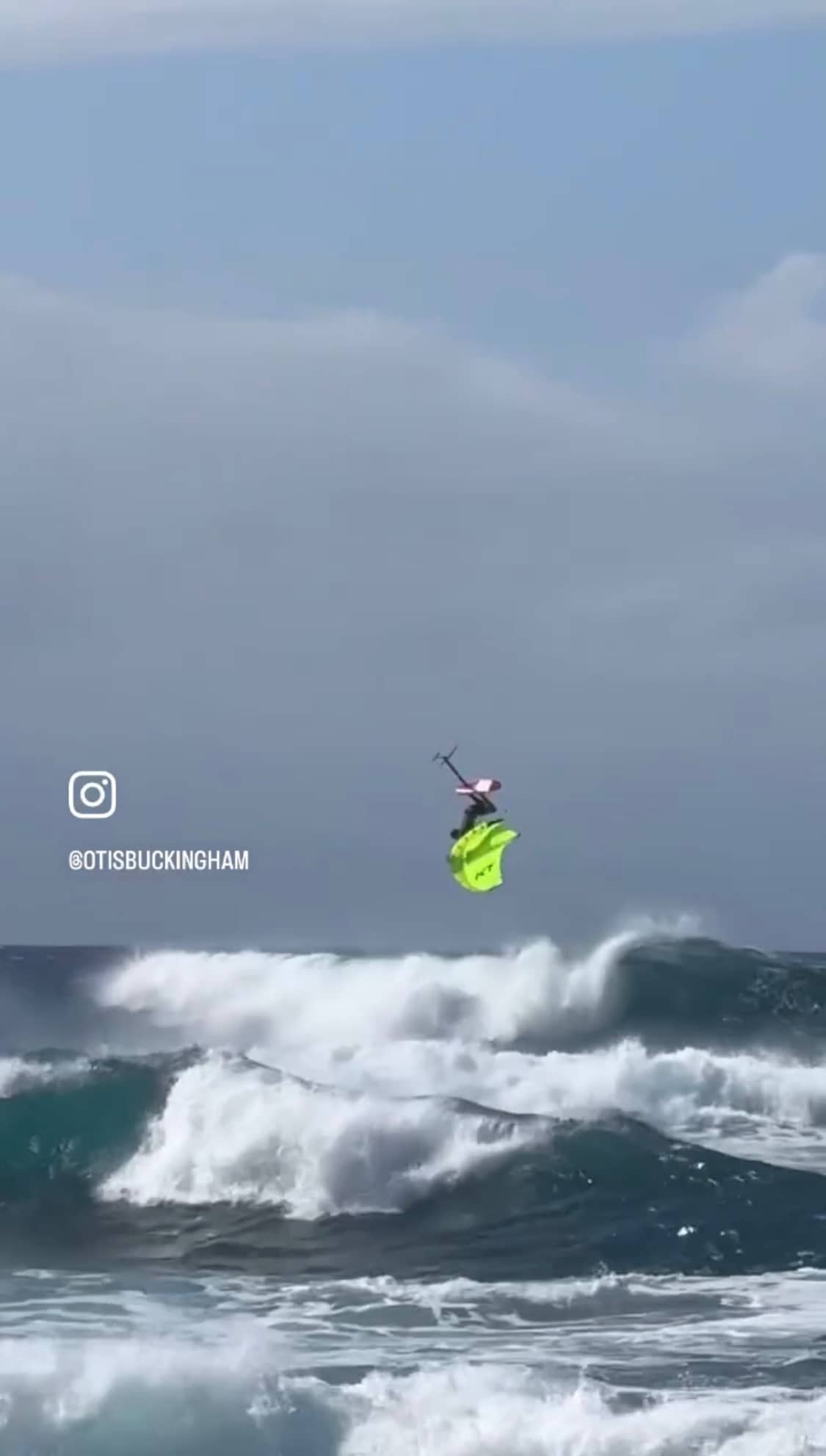 Otis Buckingham doing a backflip on his wingfoil gear while staying protected with the soft surf-helmet from Sjø Protection.