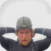 Video showing putting on a wetsuit hood on top of the soft and neat surf helmet by made by Sjø Protection.