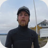 Video showing putting on the soft and surf helmet made by Sjø Protectionon top of a wetsuit hood.